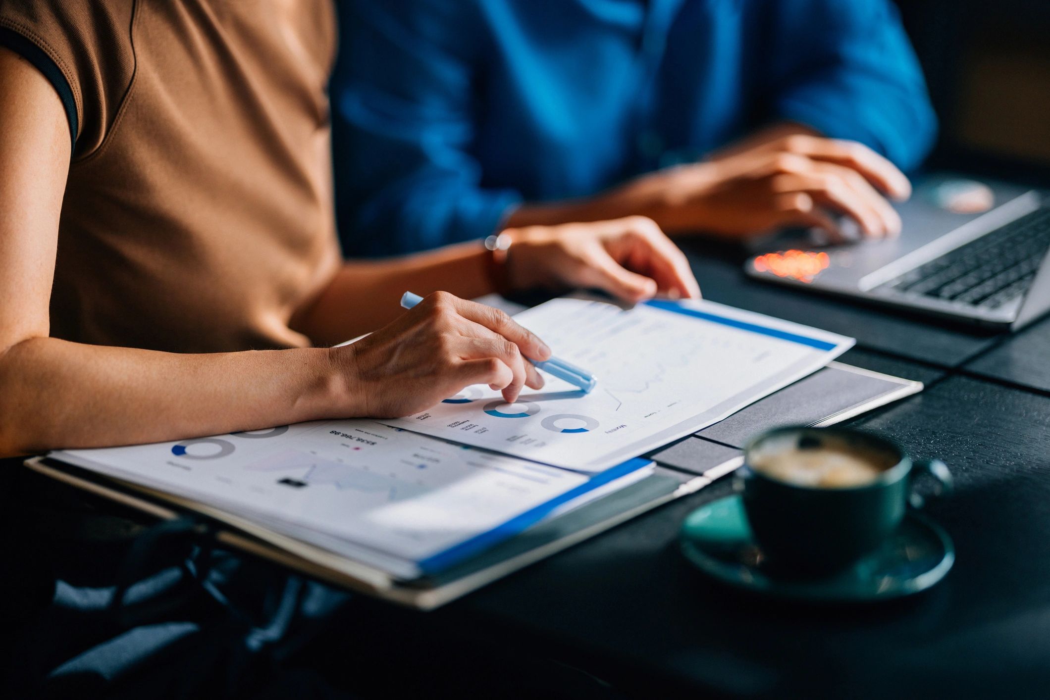 Team of consultants collaborating with small business owner